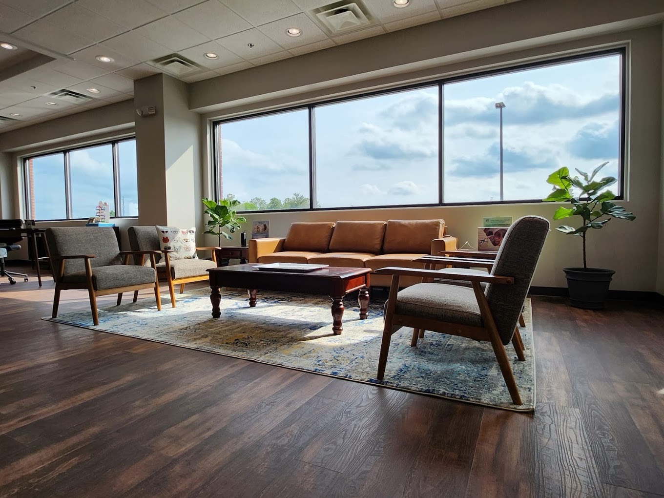 Sunlit second-floor lounge and window seating inside Harvey Eye LaGrange Road